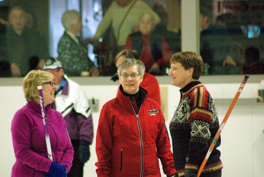 Left to right, Erna Duchemin, Donna Sharpe and Elizabeth Portman share a laugh during the recent Cecil Hicks Memorial Bonspiel.