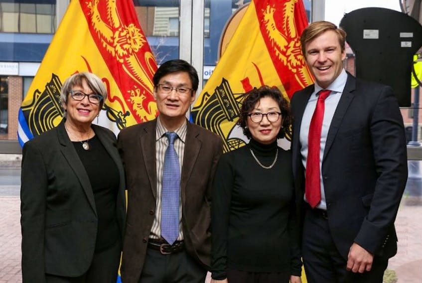 On April 1 the small business income tax rate will be cut to three per cent. This is the third cut to this rate since Jan. 1, 2015. From left: Finance Minister Cathy Rogers; David Shin and Ellen Shin, owners of Café C’est La Vie; and Premier Brian Gallant.