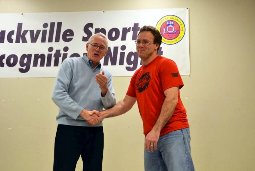 Long-time Sackville Minor Baseball Association president Chris Vogels, shown above(right) being congratulated by Sackville councillor Bill Evans during one of Sackville’s Sports Recognition Nights in this file photo, has stepped aside, with Matt Mahoney taking over the leadership reins.