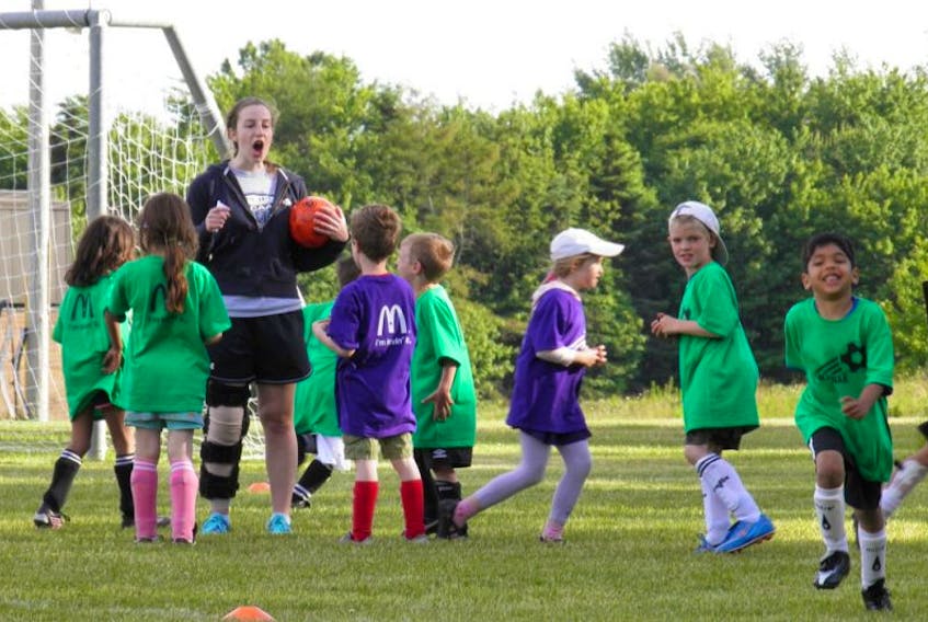 The Sackville Minor Soccer Association is still going strong after years in operation. Above, these local kids are all smiles as they go through a series of drills in this file photo.