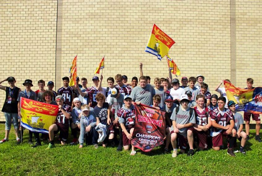 Players Evan Phinney and Terence Carter, shown above celebrating with their team, returned home from Montreal this week as Canadian U-15 national champions. Local resident Kent Johnson served as running back coach for the team.