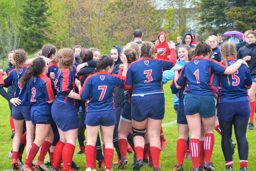 The Titans celebrate Sunday afternoon’s semifinal win over the St. Malachy’s Macs on Sackville’s Lorne Street field.
