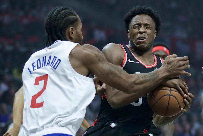 Toronto Raptors forward OG Anunoby reacts after getting hit in the eye by Los Angeles Clippers forward Kawhi Leonard during Monday's game. (AP PHOTO)