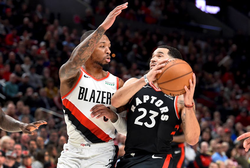 Toronto Raptors guard Fred VanVleet  drives to the basket against Portland Trail Blazers guard Damian Lillard during Wednesday's game. (USA TODAY SPORTS)