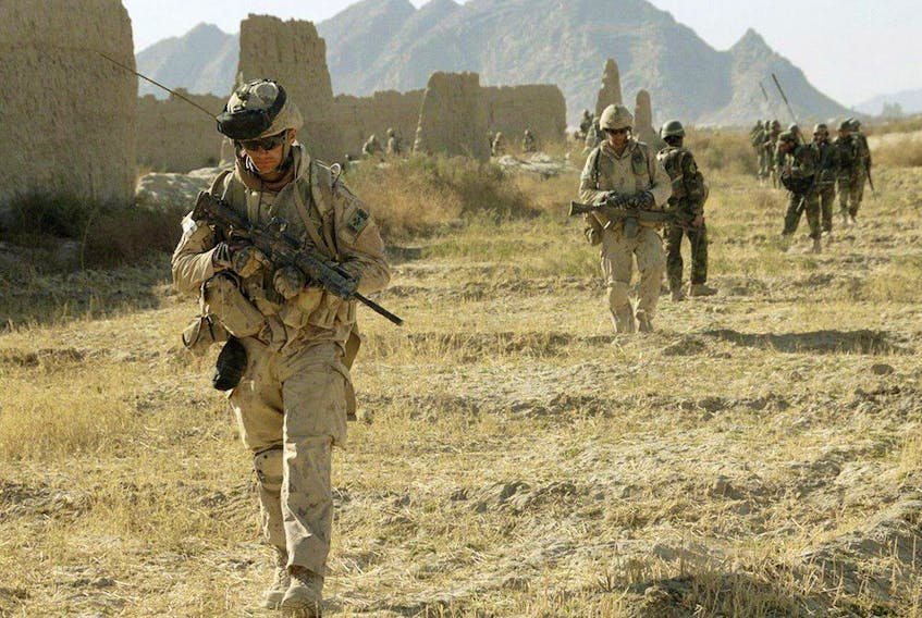Canadian soldiers on  foot patrol near the Afghan village of Haji Baba in 2009.