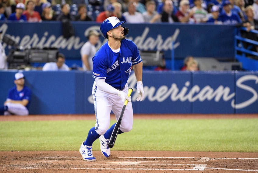 Blue Jays centre fielder Randal Grichuk  watches his ball leave the Rogers Centre on Sunday against the New York Yankees. Grichuk leads Toronto with 28 home runs this season. (Nick Turchiaro/USA TODAY Sports)