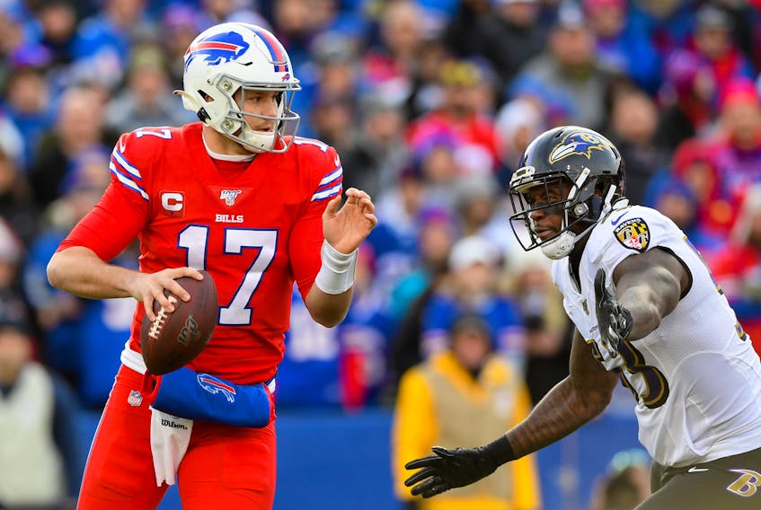 Baltimore Ravens defensive end Jihad Ward pressures Buffalo Bills quarterback Josh Allen during a game in 2019.