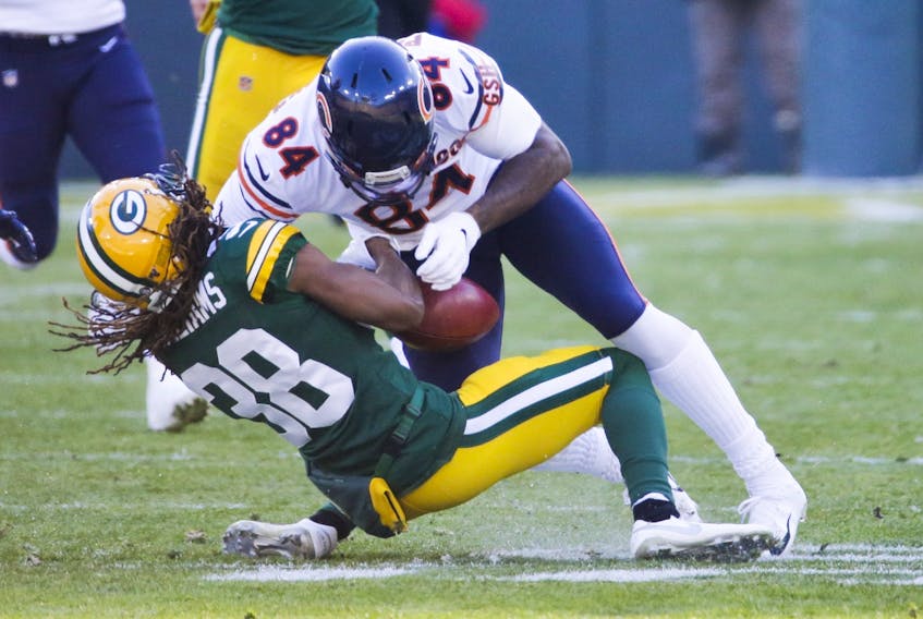 Chicago Bears' Cordarrelle Patterson hits Green Bay Packers' Tramon Williams on a punt return during Sunday's game. (AP PHOTO)
