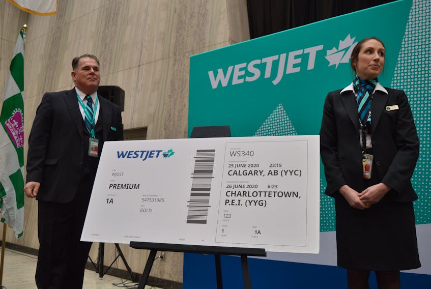 Charlottetown WestJet employees Don Roper and Chantal Mantha took part in a press conference this morning in Charlottetown where the airline announced non-stop summer service between Calgary and Charlottetown. Dave Stewart/The Guardian
