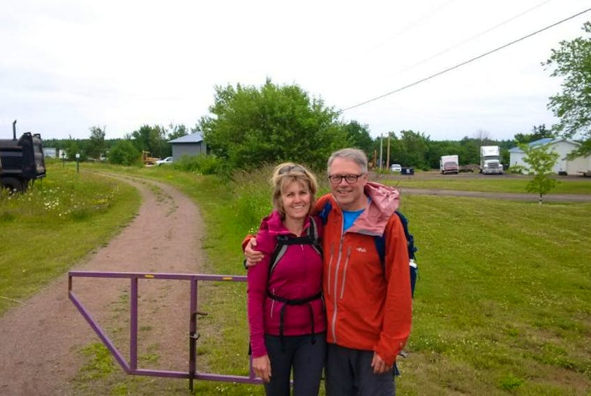 Bryson Guptill, right, and Sue Norton stopped for a photo along a section of the International Appalachian Trail at the Brackley Point Road during a recent hike.