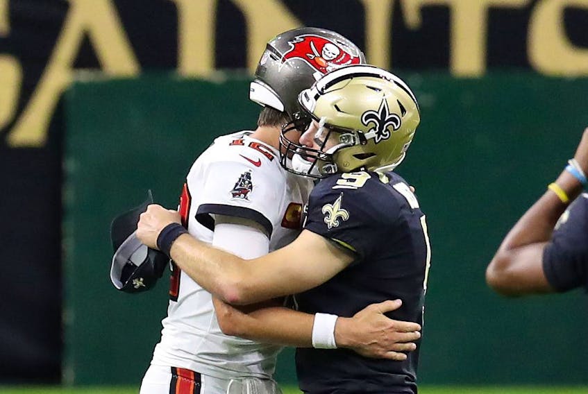 Tampa Bay's Tom Brady (left) hugs Drew Brees of the New Orleans Saints after a game earlier this season.