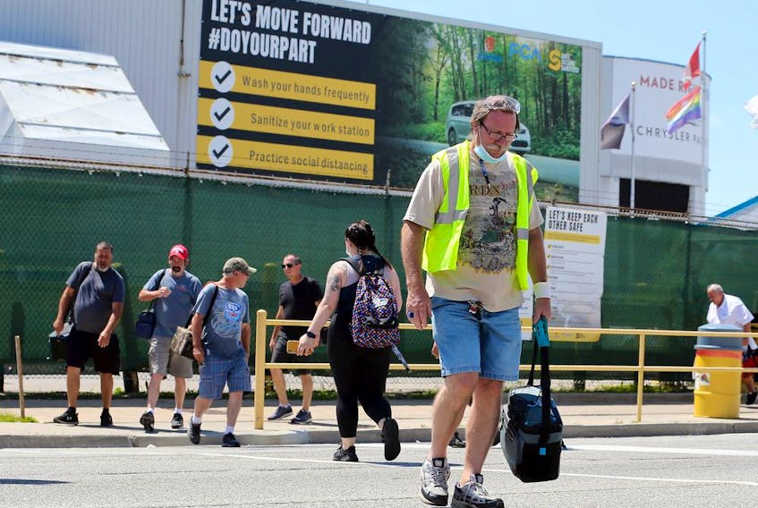 Windsor, Ontario. June 18, 2020.  Day shift workers depart as afternoon shift employees arrive at FCA's Windsor Assembly Plant Thursday.