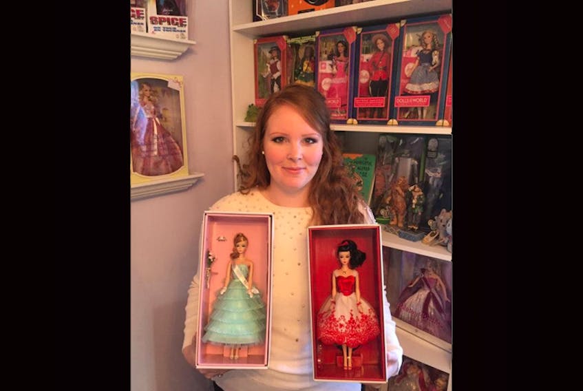 Rebecca Hollett, of Bellevue, NL, shows off some of her treasured Barbies.