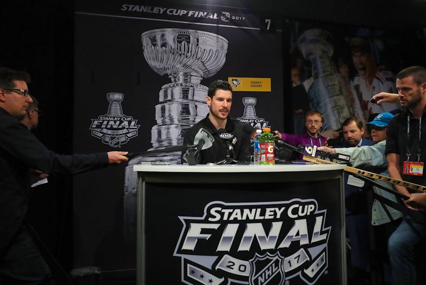 Pittsburgh Penguins' Sidney Crosby talks to reporters.