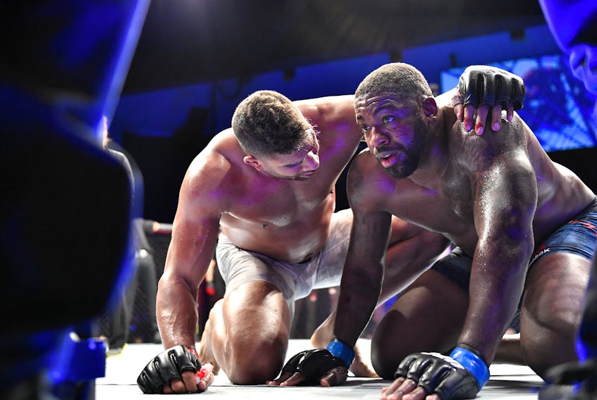 Alistair Overeem (left) consoles Walt Harris after their heavyweight bout during UFC Fight Night on Saturday.