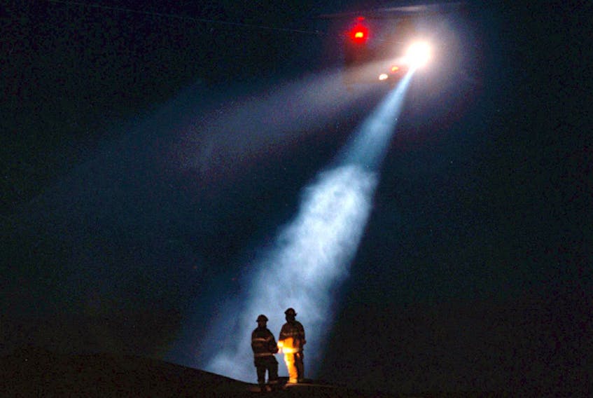 Chronicle Herald photojournalist Tim Krochak was there the night of Sept. 2, 1998, and captured an iconic image of two firefighters illuminated by the lights of a search and rescue helicopter. His photo is used here as the starting point for a collection of photos that show the rescue as it unfolded.