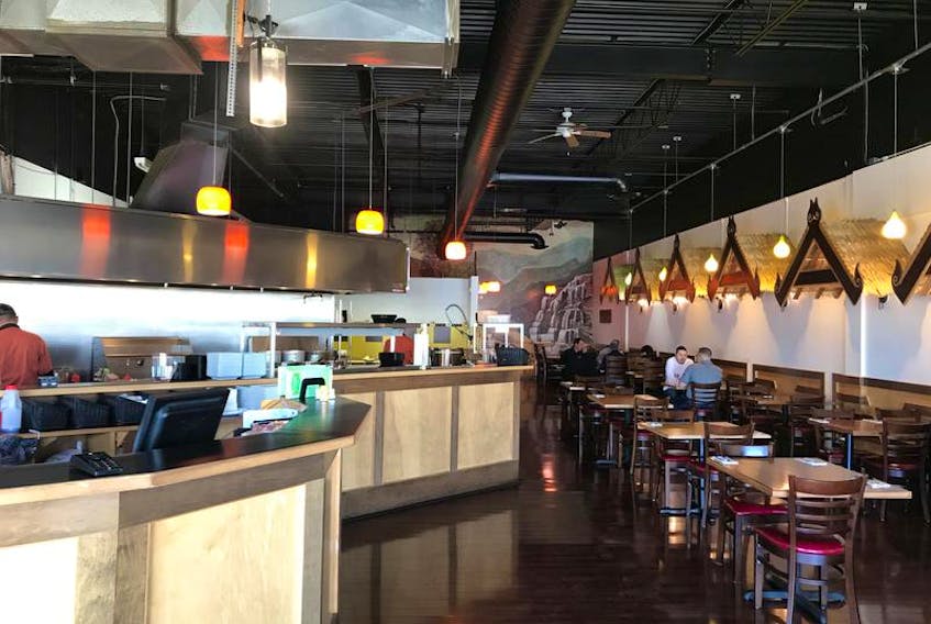 Cha Baa Thai in Dartmouth is a huge space. With high ceilings, and a massive open kitchen, the interior is warmed up with golden yellow hanging pendant lights and dark, polished wood.