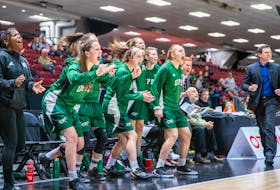 The UPEI Panthers and head coach Matt Gamblin celebrate during quarter-final action at the U Sports national women’s basketball championship in Ottawa on Thursday afternoon.