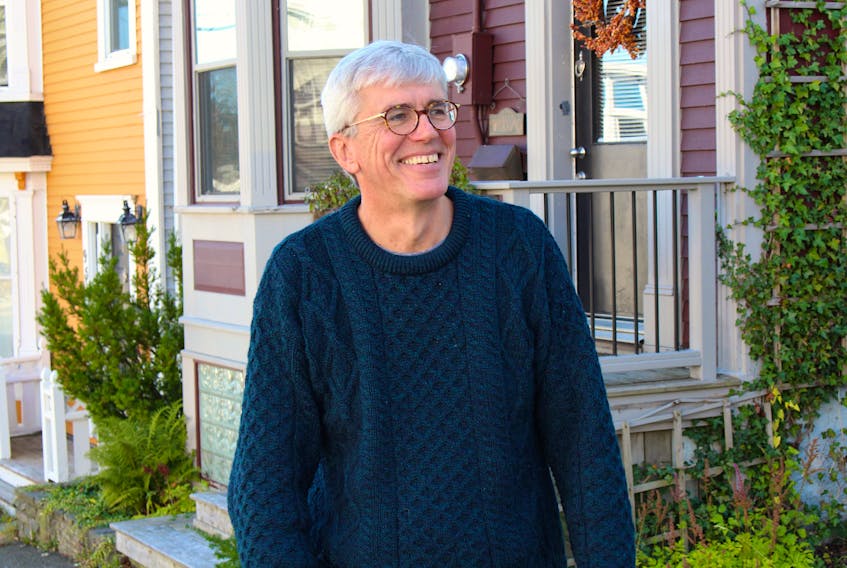 Retired architect Jim Case stands outside the house on Springdale Street in St. John's where he lived from age one until age 14. Case recently released his first novel, titled "Ananias." The narrative is built around historical records of someone he believes is one of his ancestors. — Andrew Waterman/The Telegram