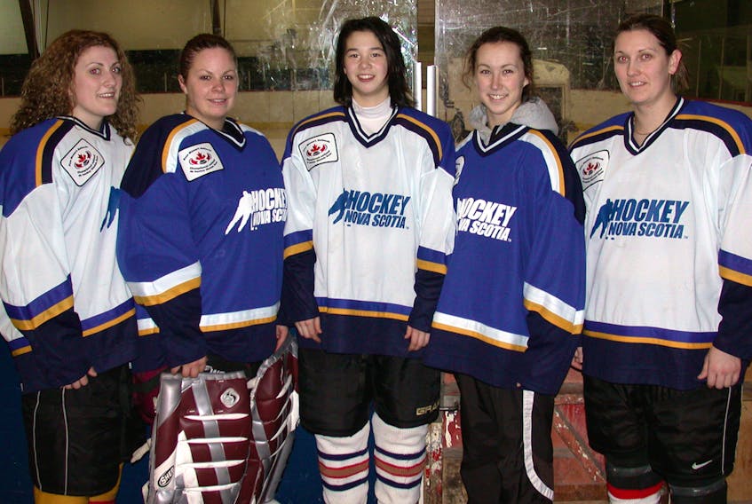 Five Cape Breton hockey players represented Nova Scotia at the 2006 Esso Women's National Hockey Championship at Centre 200 in Sydney. From left, Katie MacLeod (Inverness), Krista MacInnis (Port Hood), Jessica Wong (Baddeck), Alyssa Clarke (Donkin) and Garlene Somerton (Glace Bay). This week marks the 15th anniversary of the tournament in Cape Breton. TJ COLELLO • CAPE BRETON POST
