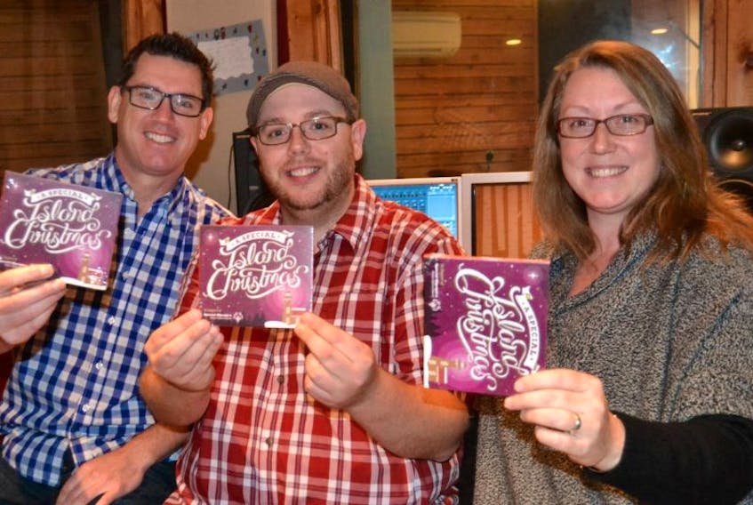 <span class="Normal">Brian J. Dunn, P.E.I. singer-songwriter, left, Jon Matthews, producer and Charity Sheehan, Special Olympics P.E.I. executive director are excited about P.E.I. Mutual's "A Special Island Christmas" CD.</span>