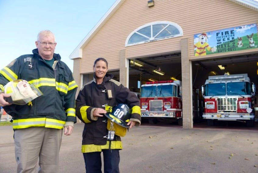 District Deputy Chief Gerard McMahon and new Station 2 firefighter Allana Monkley promote Fire Safety Week in Prince Edward Island.