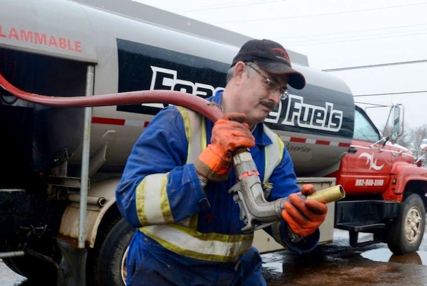 Tracy Elwood, with Feasible Fuels, gets ready to make an oil delivery in Charlottetown recently.