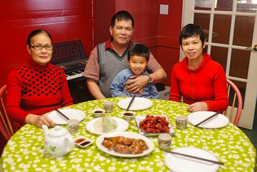 Anna Zeng, right, owner of King’s BBQ and Chinese Food in Charlottetown, along with her mother, Xue Bing Huang, father, Yong Chen Zeng, and her son, Anson Xu, will be celebrating Christmas in Charlottetown with traditional Chinese food.