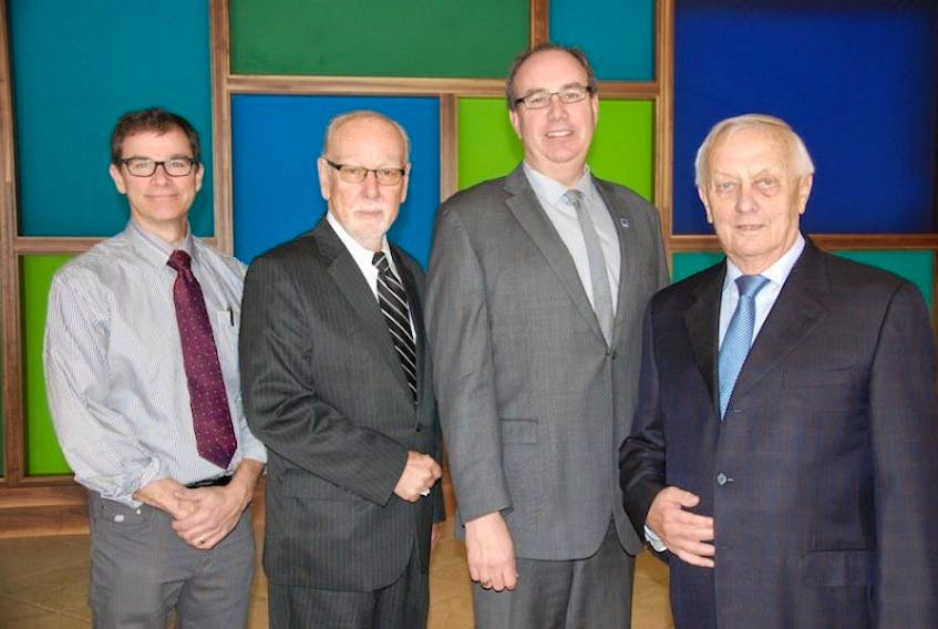 <br />Bernie Kenna, vice chair of the Junior Achievement of P.E.I. board of governors, second right, poses with the 2014 Business Hall of Fame inductees. From left to right are Roger Wightman representing his father Arnold, Albert Ferris and Don Allan.