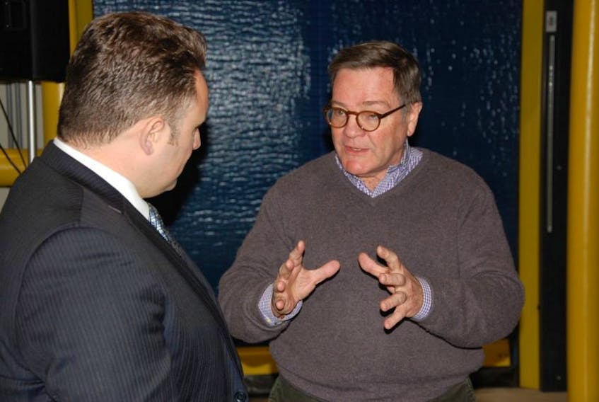 ACOA Minister Rob Moore chats with Ed Flannagan, CEO and president of Jasper Wyman and Son, at a news conference at the Morell blueberry facility Tuesday.
