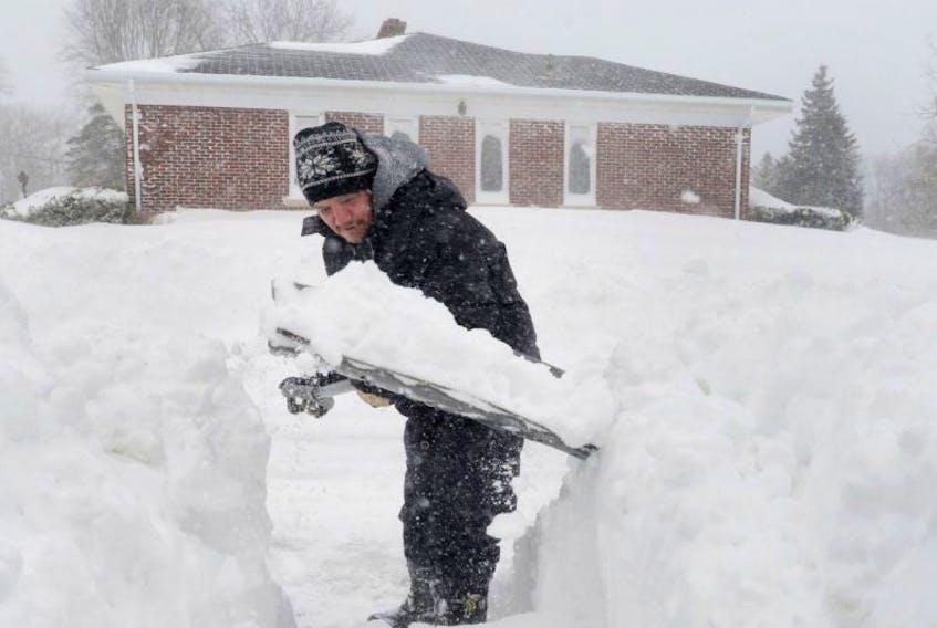 <p class="p1">Billy Doucette shovels his walkway in this Guardian file photo.</p>
