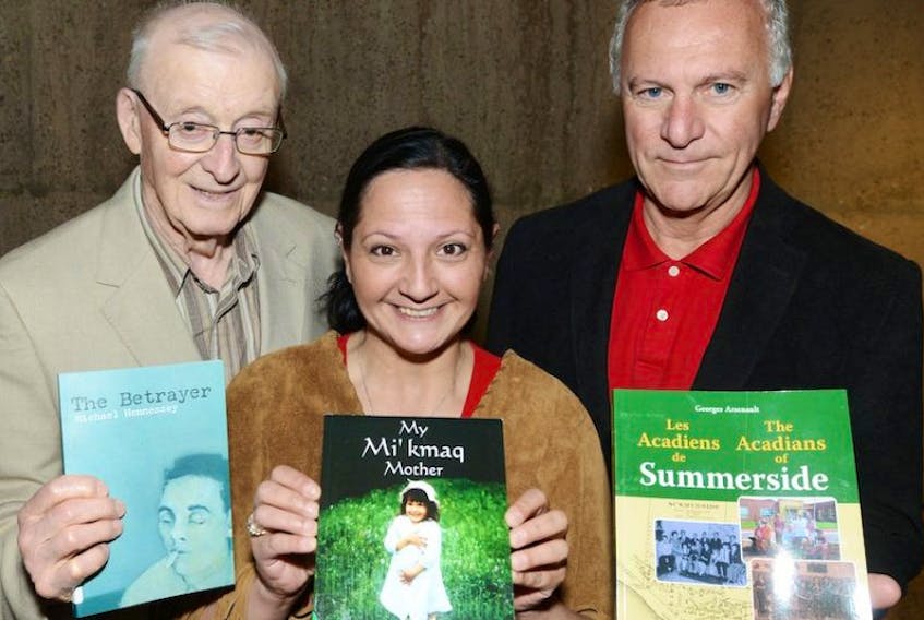 Michael Hennessey, author of The Betrayer, Julie Pellissier, author of My Mi'kmaq Mother, and Georges Arsenault, Author of Les Acadiens de Summerside, launched their books along with 11 others Wednesday at the Confederation Centre of the Arts.