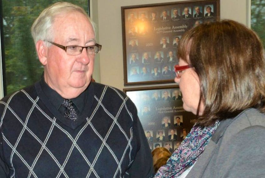 Dr. Des Colohan speaks with Morell-St. Peters MLA Olive Crane outside the legislative standing committee on health in Charlottetown Wednesday, Oct. 1.