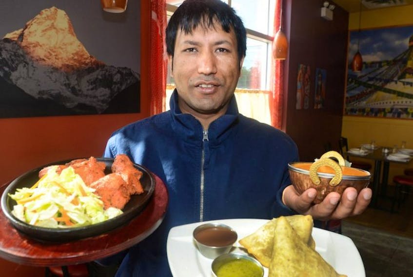 Anuj Thapa, who operates the Himalayan Curry restaurant in Charlottetown, says bureaucratic barriers make it difficult for new businesses to start in P.E.I.