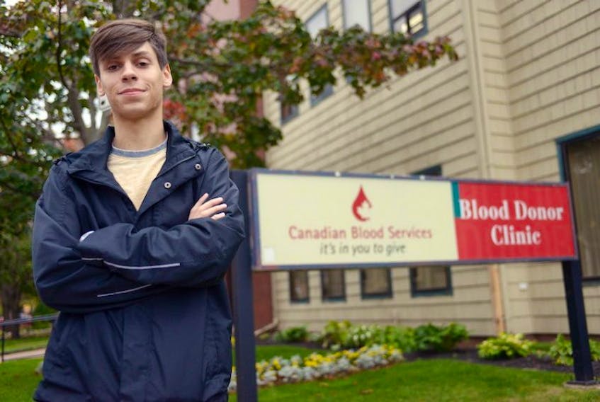 Tyler Murnaghan, interim chairman of Pride P.E.I., is upset that men who have had sex with men within the past five years are banned from donating blood. He is standing in front of the Canadian Blood Services offices in Charlottetown.