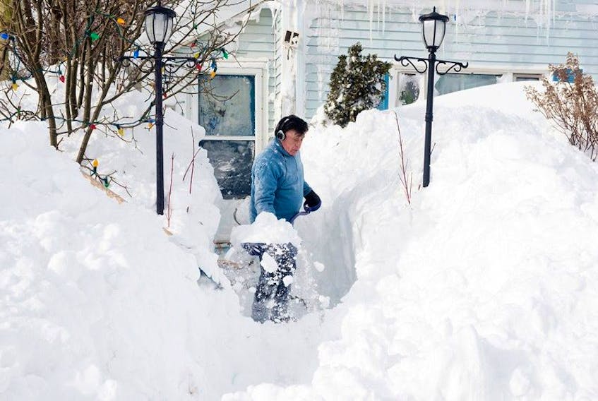 Sterling Ramsay of Charlottetown shovels a path from his house to the street.