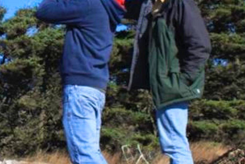 Richard Elliot, right, is shown conducting a bird survey with his son, Malcolm. Elliot, director of Wildlife Research with Environment Canada, spoke at a recent Nature P.E.I. meeting.