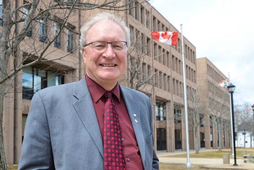 Premier Wade MacLauchlan outside the provincial government buildings in Charlottetown Tuesday, a day after leading the Liberals to a third straight majority government.