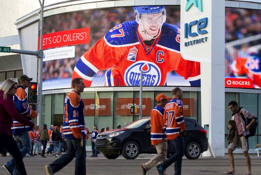 Oilers fans arrive at Rogers Place prior to the Edmonton Oilers and San Jose Sharks NHL playoff, in Edmonton Thursday April 20, 2017. 