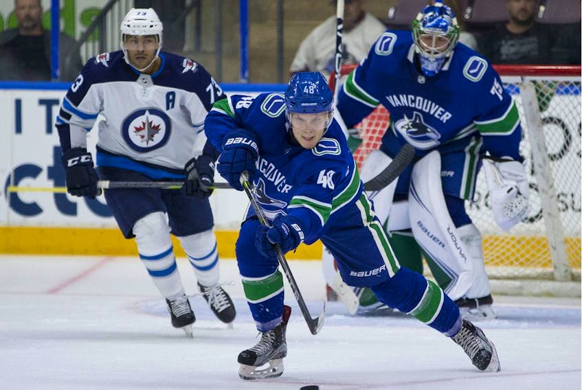Vancouver Canucks defencemen Olli Juolevi clears the puck ouf of harm's way with an outlet pass during Friday's opening game against Winnipeg Jets prospects at the Young Stars Classic in Penticton.