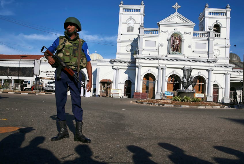 A security officer stands in front of St Anthony's shrine in Colombo, after bomb blasts ripped through churches and luxury hotels on Easter, in Sri Lanka April 22, 2019.  Athit Perawongmetha