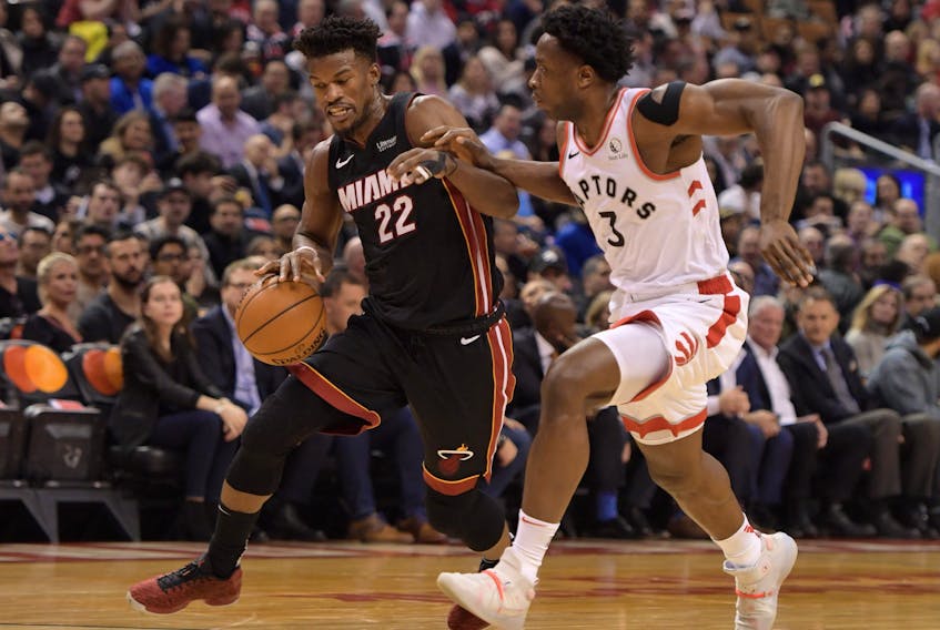 Miami Heat forward Jimmy Butler, left, dribbles the ball as Toronto Raptors forward OG Anunoby defends in the first half at Scotiabank Arena, Dec. 3, 2019. (Dan Hamilton-USA TODAY Sports)