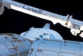 The Canadarm2 robotic arm, built by Canadian technology company MDA, is seen over the uncrewed SpaceX Crew Dragon spacecraft as it makes the first Commercial Crew vehicle to visit the International Space Station March 4, 2019. - NASA / Handout via Reuters
