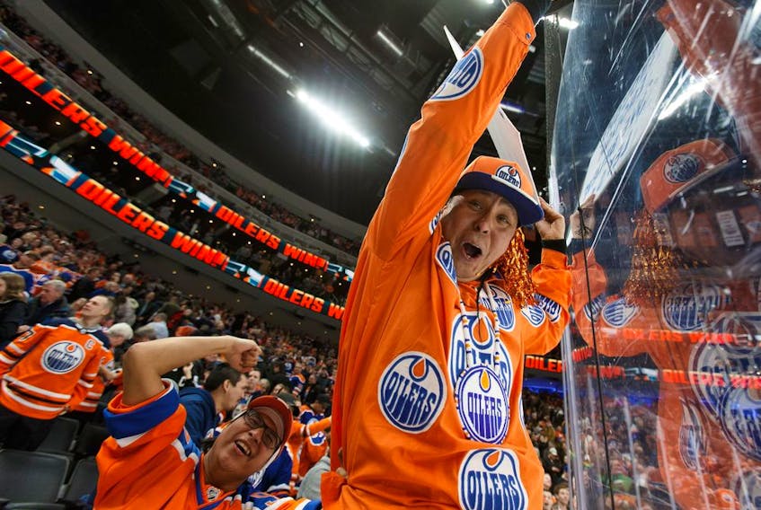 Fans celebrate Edmonton Oilers forward Leon Draisaitl's game-winning goal over the New York Rangers during NHL action at Rogers Place in Edmonton on March 11, 2019.