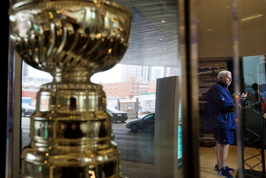 A replica Stanley Cup is visible in the foreground as then-Edmonton Oilers head coach Ken Hitchcock speaks to the media at Rogers Place in this file photo from March 25, 2019.