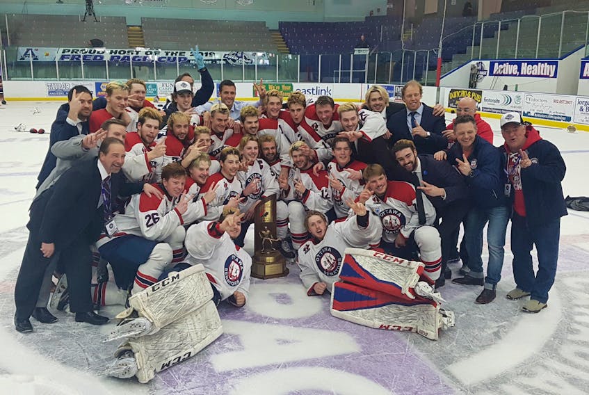 The Ottawa Junior Senators celebrate with the Fred Page Cup after defeating the Princeville Titan on Sunday to claim their second consecutive Eastern Canadian junior A hockey championship. - James Faulkner/MHL