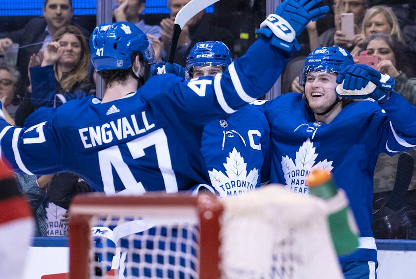 Toronto Maple Leafs right wing William Nylander, right, celebrates scoring a goal with centre John Tavares, centre,  during the second period against the New Jersey Devils at Scotiabank Arena, Jan. 14, 2020. (Nick Turchiaro-USA TODAY Sports)