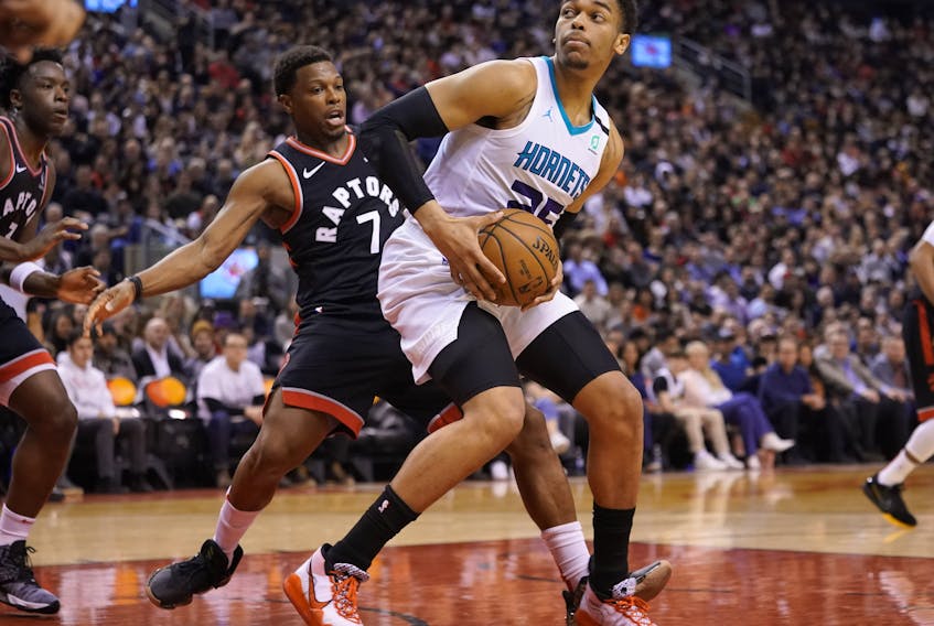 Charlotte Hornets forward PJ Washington, right, drives to the net against Toronto Raptors guard Kyle Lowry during the first half at Scotiabank Arena, Feb. 28, 2020. (John E. Sokolowski-USA TODAY Sports)
