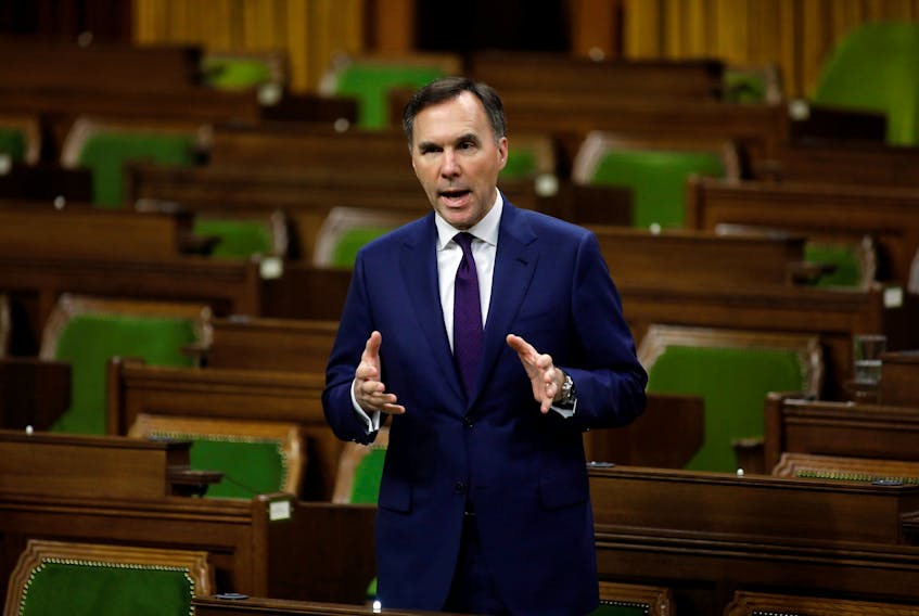 Federal Finance Minister Bill Morneau speaks in the House of Commons as MPs convene to give the government power to inject billions of dollars in emergency cash to help individuals and businesses through the economic crunch caused by the novel coronavirus outbreak, on Parliament Hill in Ottawa, on Wednesday, March 25, 2020. - Blair Gable / Reuters
