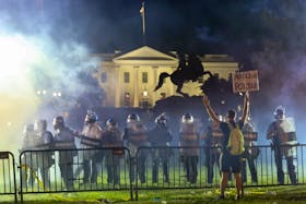 Police in riot gear keep protesters at bay in Lafayette Park near the White House in Washington, on May 31, 2020.